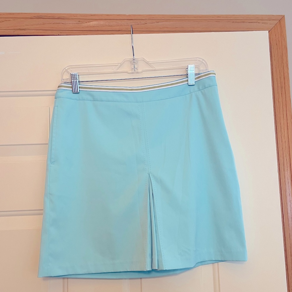 Women’s Greg Norman blue  front kick pleat golf tennis skort with pocket. Size 4